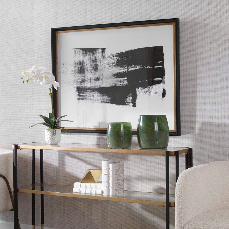Uttermost Mystere framed contemporary black canvas art print displayed on a wall. Modern wall decor with bold abstract design.