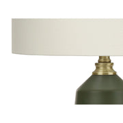 Contemporary green ceramic table lamp by 8th Street with a sleek rounded design and a fabric lampshade.