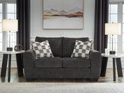 Benchcraft® Loreo stationary loveseat with plush cushions and modern design, perfect for cozy living room seating.