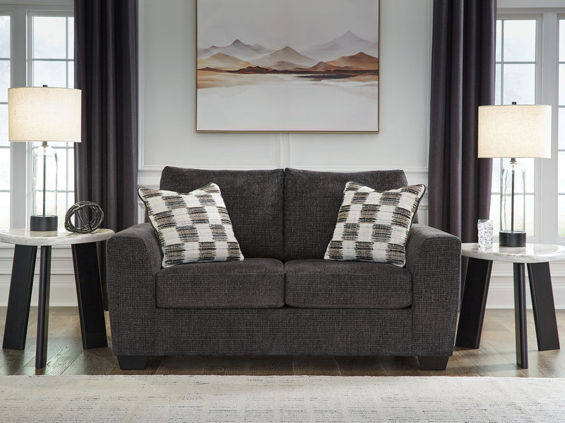 Benchcraft® Loreo stationary loveseat with plush cushions and modern design, perfect for cozy living room seating.