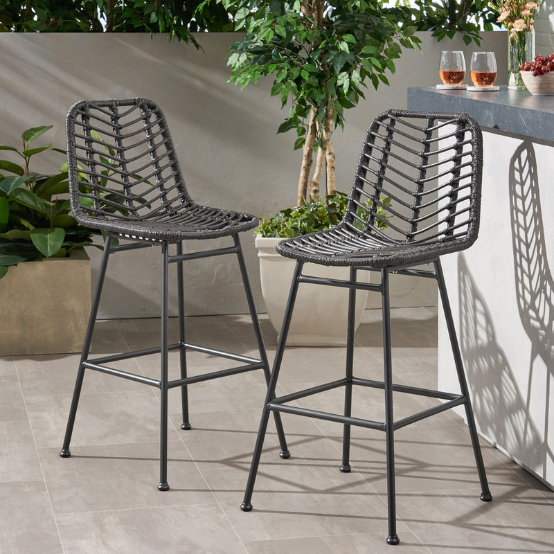 Noble House Sawtelle outdoor wicker barstools set of 2 with cushioned seats and curved armrests for patio or outdoor bar use.