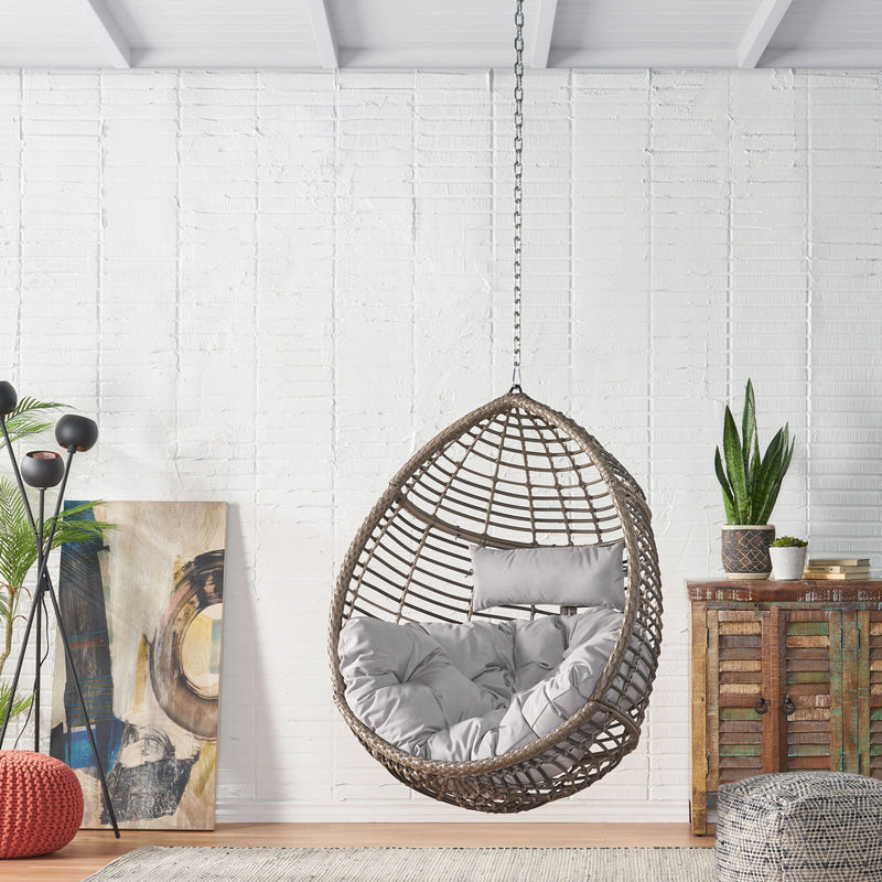 Noble House Morris Teardrop hanging chair with chain and water-resistant cushions, outdoor hammock seating for relaxation.
