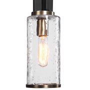 Uttermost Jarsdel 1-light black industrial mini pendant light hanging with metal details and modern design.