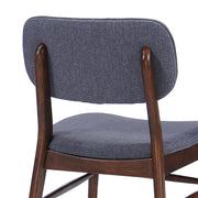 Set of two upholstered Noble House comfort dining chairs with padded seats and high backs in a neutral fabric.