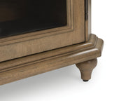 Signature Design by Ashley Barlomore accent cabinet in brown with sleek storage doors and modern style.