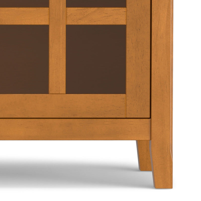 Simpli-Home Acadian TV media stand with open shelves and cabinet storage, made of wood with a warm finish.