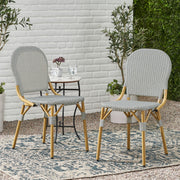 Set of two Noble House outdoor rattan and aluminum armless French bistro chairs in dark gray, with woven rattan seats and sleek frame