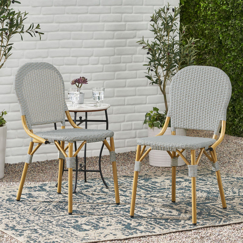 Set of two Noble House outdoor rattan and aluminum armless French bistro chairs in dark gray, with woven rattan seats and sleek frame