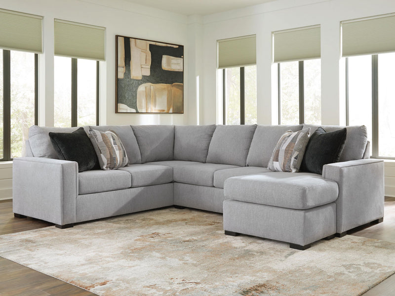 Benchcraft Lakepoint stationary sectional sofa with plush cushions and modern design, shown in a spacious living room setting.
