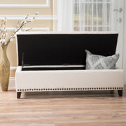 Beige upholstered storage ottoman with nailhead trim from Noble House, showing soft fabric and sturdy wooden legs.