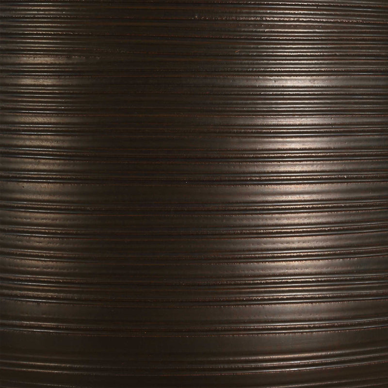 Uttermost Calderone bronze table lamp with a sleek, modern design and a cylindrical shade, perfect for stylish home lighting.
