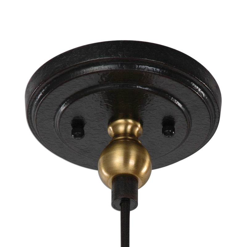 Uttermost Adastra 1-light pendant in antique brass, showcasing a sleek modern pendant light fixture with a warm metallic finish.