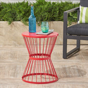 Noble House Lassen modern outdoor side table with hourglass design, featuring sleek black metal frame and round tabletop.