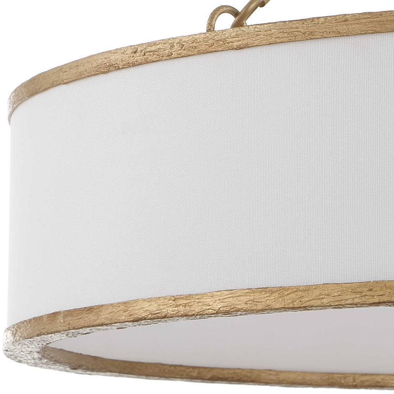 Uttermost Algiers 8-light drum pendant lighting fixture with gold and white finish, hanging from the ceiling.
