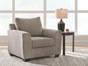 Loreo arm chair by Benchcraft® featuring plush upholstery and modern design, shown from a front angle.