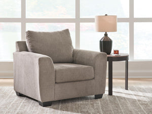 Loreo arm chair by Benchcraft® featuring plush upholstery and modern design, shown from a front angle.
