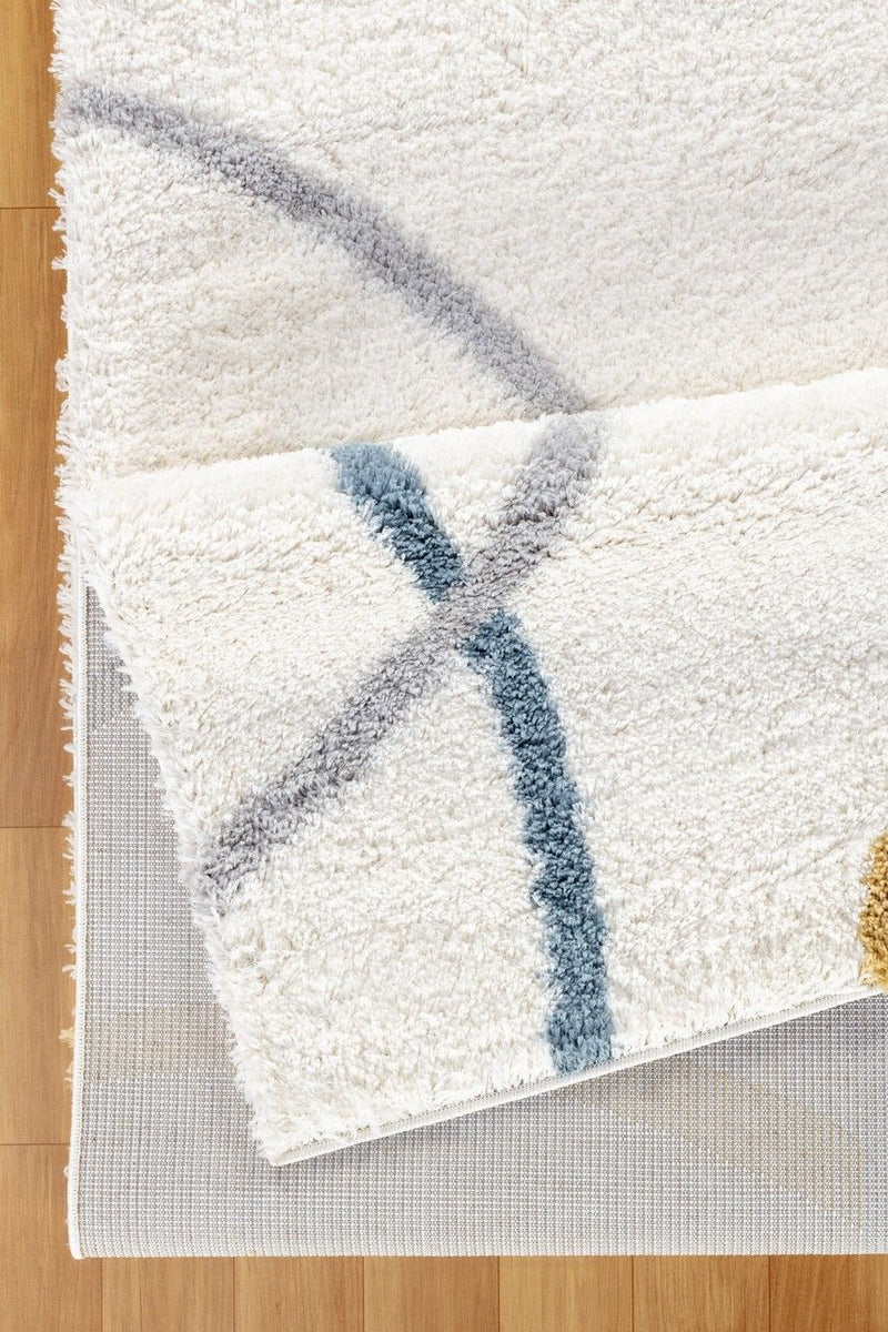 Loft Shag - 5' 3" X 7' Polypropylene Shaggy Area Rug - Ivory - R&R Furniture Gallery (Fountain Valley, CA)