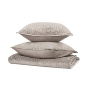 Velvet quilt set with matching shams from Classic Home's Bari collection, featuring soft fabric and elegant design.