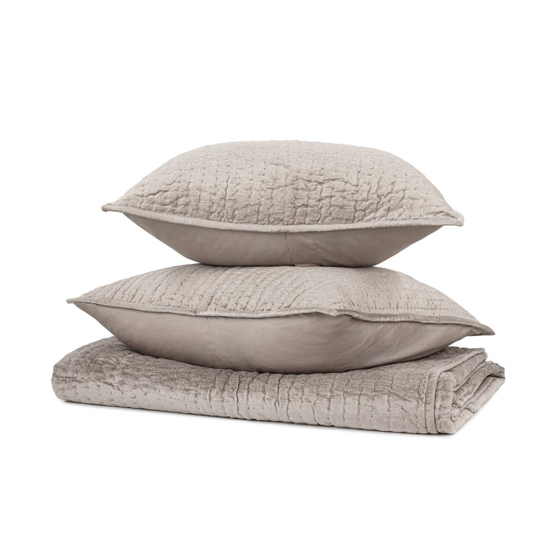 Velvet quilt set with matching shams from Classic Home's Bari collection, featuring soft fabric and elegant design.