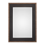 Uttermost Staveley Rustic Black Wall Mirror with a textured wooden frame, stylish and versatile for modern or rustic decor.