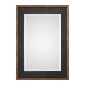 Uttermost Staveley Rustic Black Wall Mirror with a textured wooden frame, stylish and versatile for modern or rustic decor.