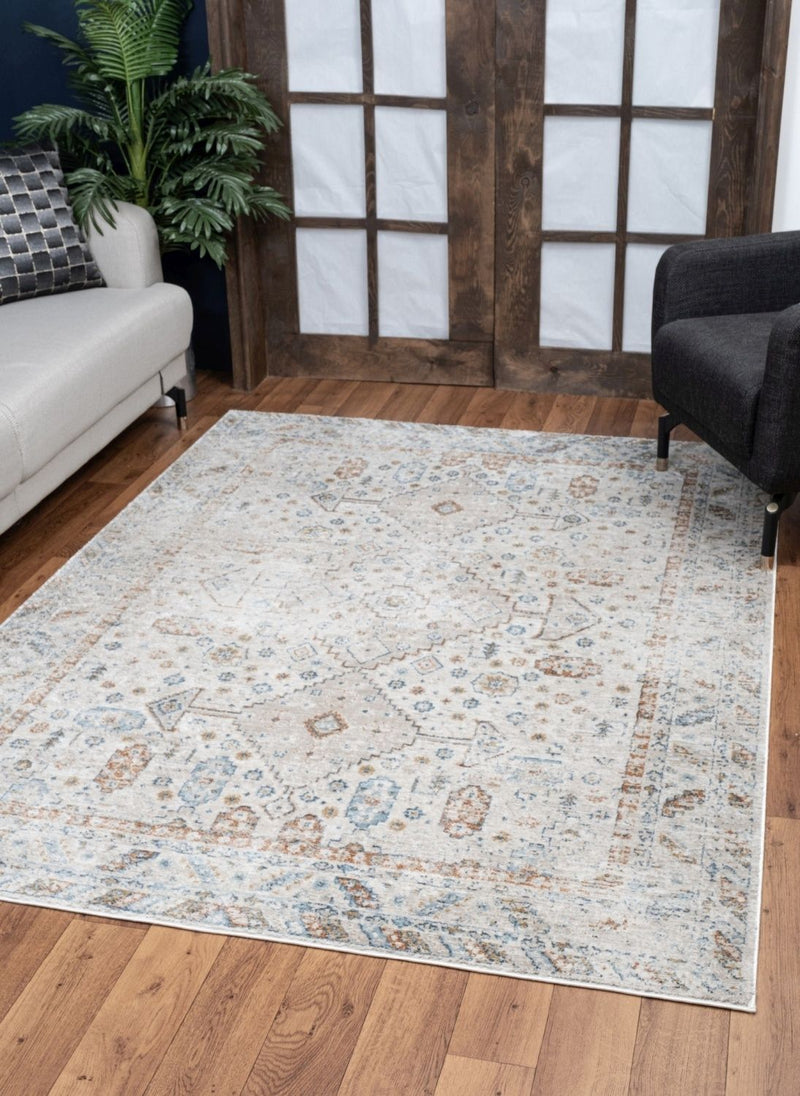 Noble - 5'3" X 7'3" Polyester Area Rug - Ivory - R&R Furniture Gallery (Fountain Valley, CA)