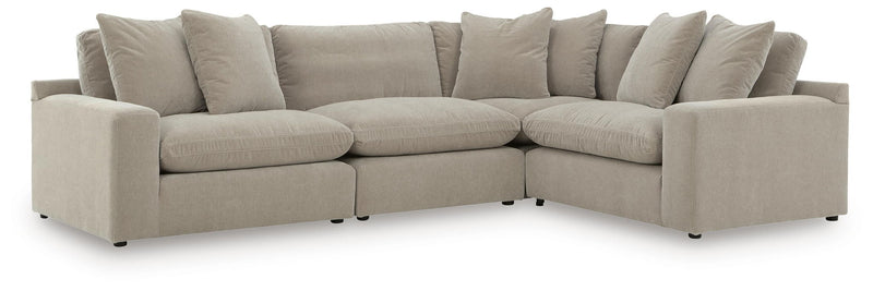 Benchcraft Maxton Heights stationary sectional with plush fabric seating and modern design, shown in a neutral color.