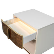 Michael Amini Pavira accent nightstand with sleek wood finish and modern design, featuring a single drawer and smooth surface.