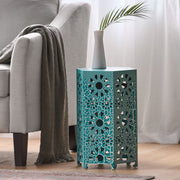 Noble House Eliana side table with a sleek design, featuring a round wooden top and modern metal legs.