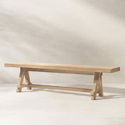 Jennifer Taylor Home Hawthorne dining bench in natural wood finish, showcasing a sleek, modern design with a sturdy wooden frame.