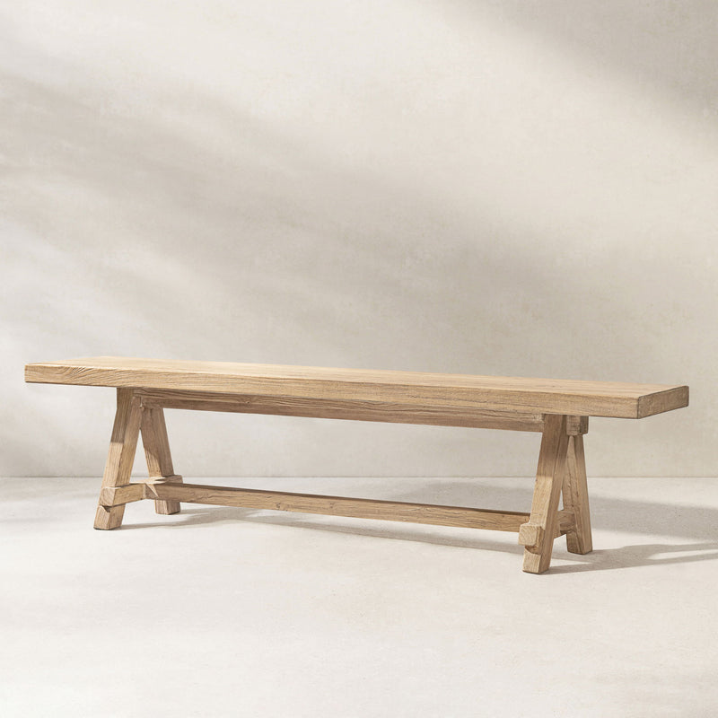 Jennifer Taylor Home Hawthorne dining bench in natural wood finish, showcasing a sleek, modern design with a sturdy wooden frame.