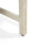 Set of two Noble House outdoor dining chairs with acacia wood frames, featuring armrests and slatted seat design.