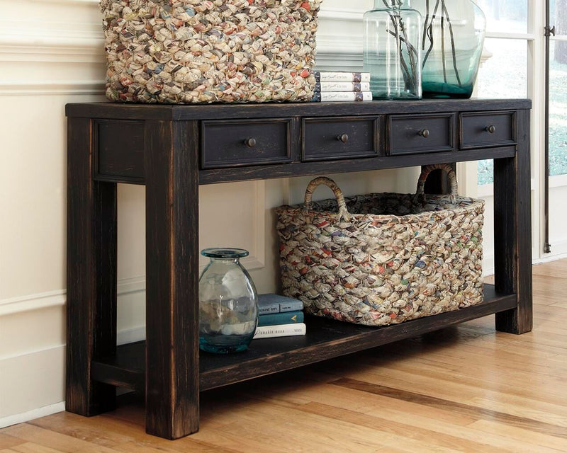 Black Gavelston sofa table by Signature Design Ashley, featuring a sleek rectangular surface and modern design for living room decor.