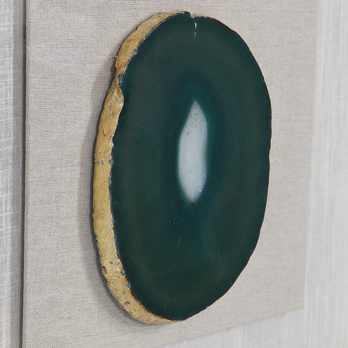 Keeva agate stone shadow box wall decor in gold by Uttermost, featuring a natural agate stone with a sleek gold frame.