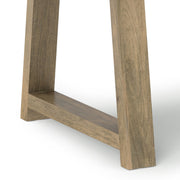 Wooden Whitley dining table by Simpli-Home with a smooth surface and sturdy legs, ideal for modern dining rooms.