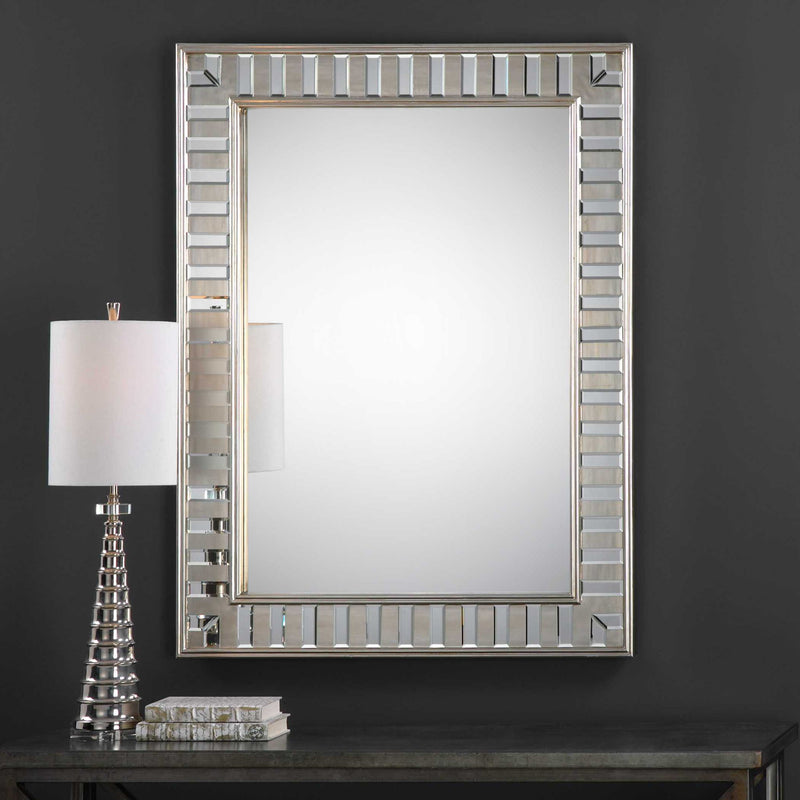 Silver Lanester Leaf Wall Mirror by Uttermost featuring a leaf-shaped frame and reflective glass surface.