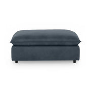 Classic Home Caplan upholstered ottoman with soft fabric and cushioned top, ideal as a versatile living room accent piece.