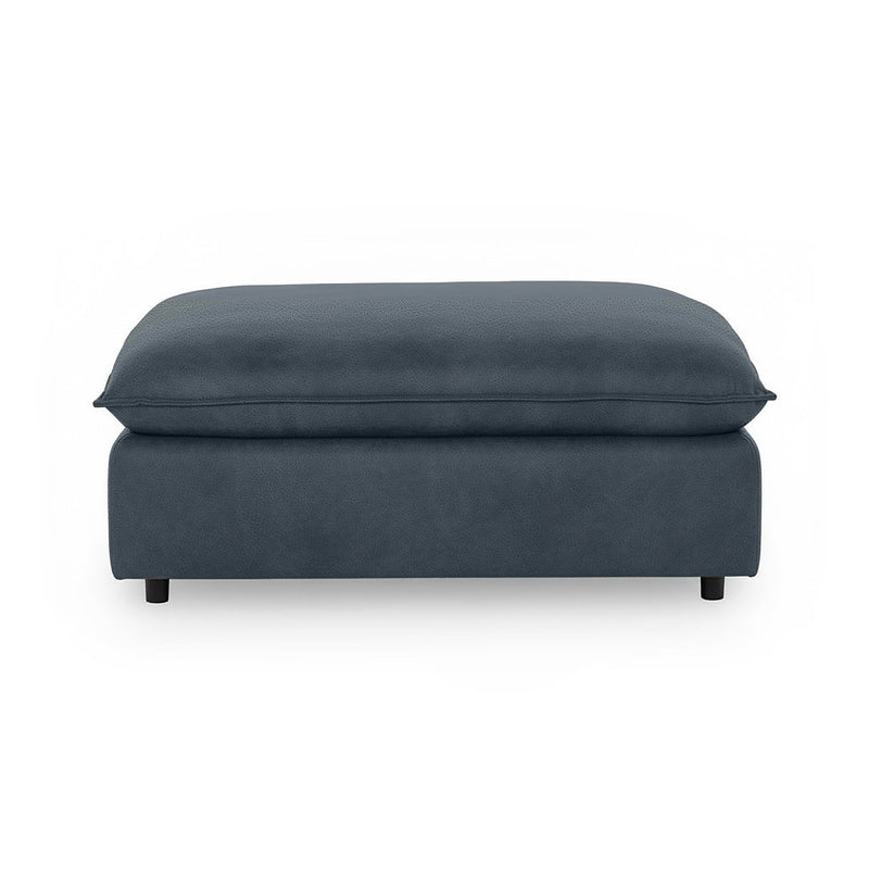 Classic Home Caplan upholstered ottoman with soft fabric and cushioned top, ideal as a versatile living room accent piece.