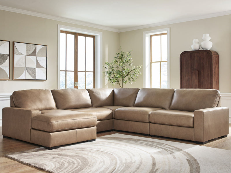 Benchcraft Veronella stationary sectional sofa with plush cushions and modern design, shown in a spacious living room setting.