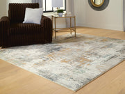 Signature Design by Ashley® Torinette area rug with intricate geometric patterns in neutral tones, perfect for living rooms and bedrooms.
