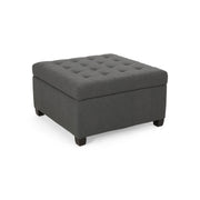 Noble House Isabella contemporary storage ottoman with upholstered top and wooden legs, serving as a versatile seating and storage piece.