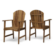 Two outdoor weather-resistant acacia wood Adirondack dining chairs by Noble House, featuring wide armrests and slatted backrests.