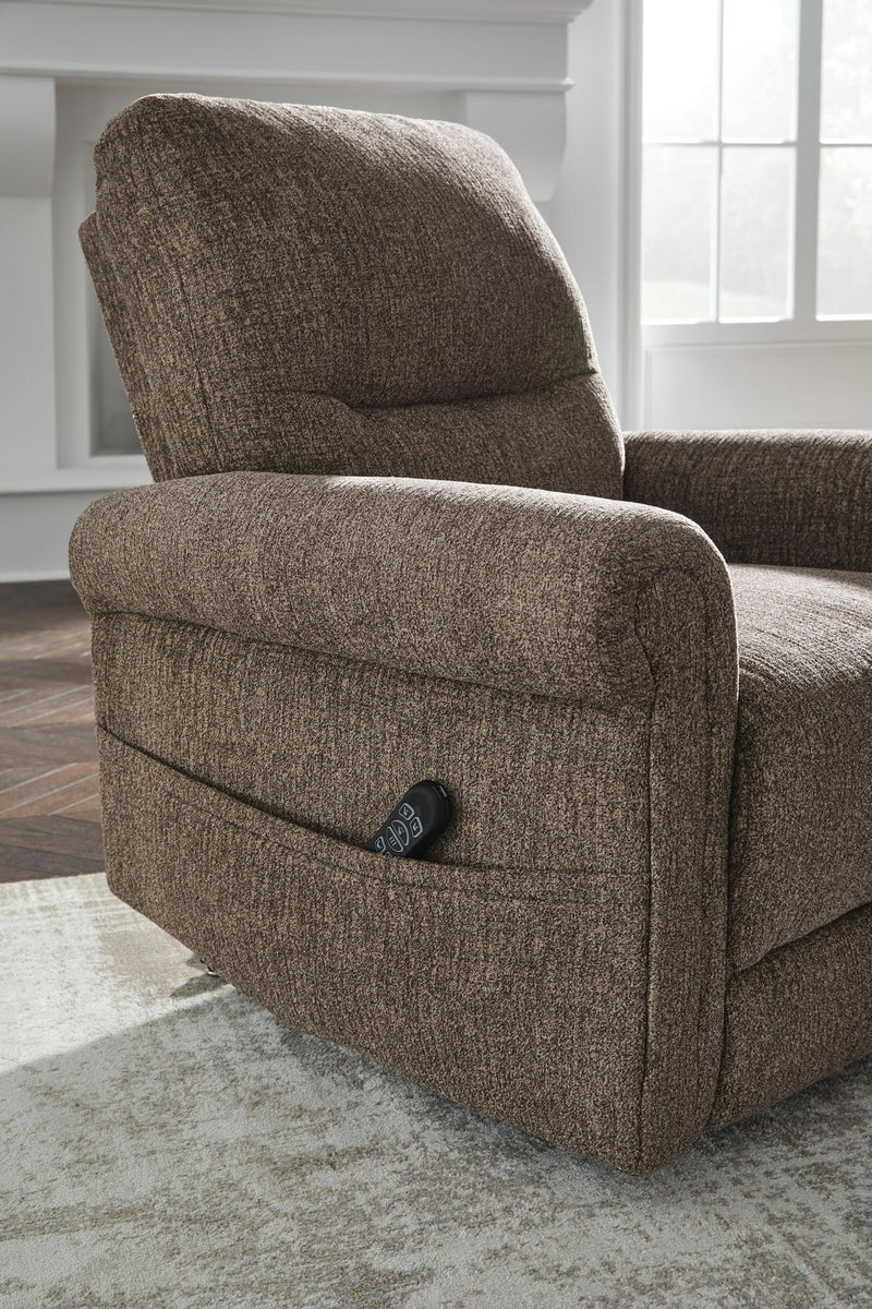 Signature Design by Ashley Aureta Power Lift Recliner in plush fabric, showing the comfortable, adjustable lift chair with remote control.