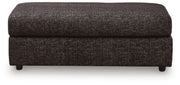 Black oversized accent ottoman from Signature Design by Ashley® Lentiz collection, with plush fabric and modern design.