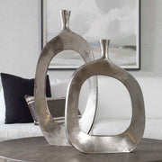 Pair of Pearl Silver aluminum vases from Uttermost Cierra collection, featuring sleek, modern design and smooth metallic finish.