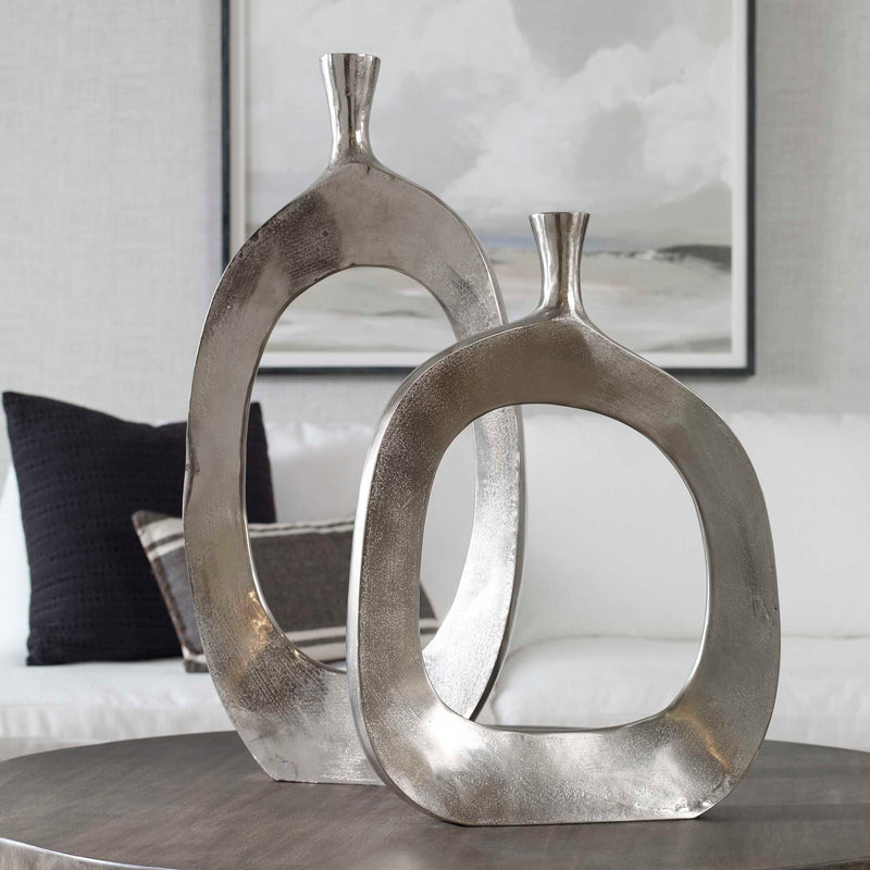 Pair of Pearl Silver aluminum vases from Uttermost Cierra collection, featuring sleek, modern design and smooth metallic finish.