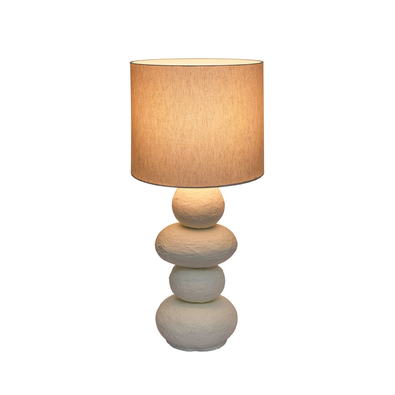 TOV Furniture Pebble Papier Mache Lamp, modern table lamp with textured, rounded pebble design and neutral finish on a wooden surface.