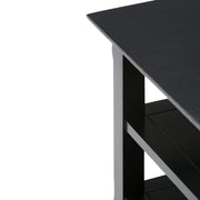 Handcrafted Acadian end table by Simpli-Home featuring a wooden surface and sturdy legs, perfect for living room decor.