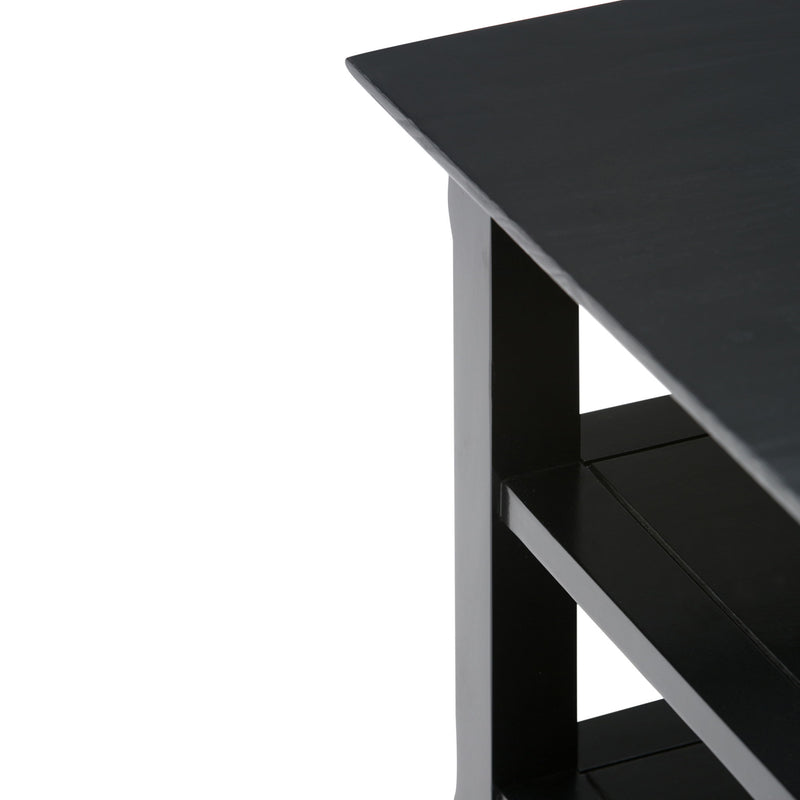Handcrafted Acadian end table by Simpli-Home featuring a wooden surface and sturdy legs, perfect for living room decor.
