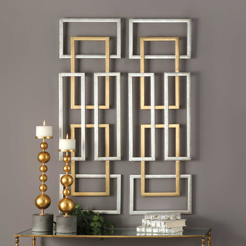 Set of two gold geometric wall art pieces by Uttermost, modern wall decor with intricate metal designs for stylish interior accents.